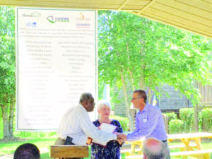 Rockdale Chairman Richard Oden present Jeff Beech, founder of Lighthouse Village and Phoenix Pass, and Jean Yontz, executive director, with proclamation declaring June 10, 2016 as Phoenix Pass Day in Rockdale County