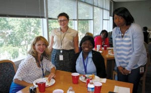 Attorneys Dana Pagan, Joelle Nazaire and Daniela Costan lunch with high school student Angelic Showalter on June 3 at the Gwinnett S.M.I.L.E. program.
