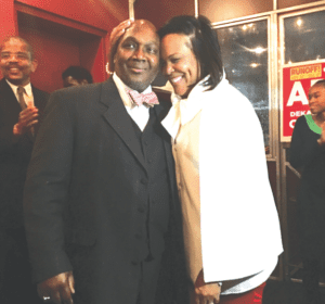 Gregory Adams gets a hug from his wife, Jacqueline, at his victory party, which was held at Marlow’s Tavern in Atlanta. Photo provided.