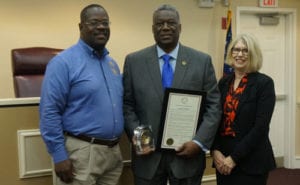 Chairman-Elect Oz Nesbitt and Commissioner Doreen Williams present Chairman and CEO Richard Oden a proclamation decalring Dec. 14 as 'Richard A. Oden Day'