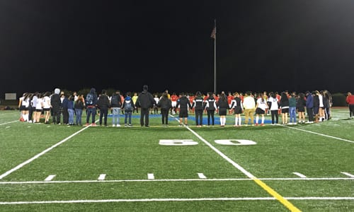 Cross Keys High School’s soccer team has a moment of silence Feb. 13 for Miguel Jaimes Martinez, who became ill and died from flu complications. Photo by Travis Hudgons/OCGNews