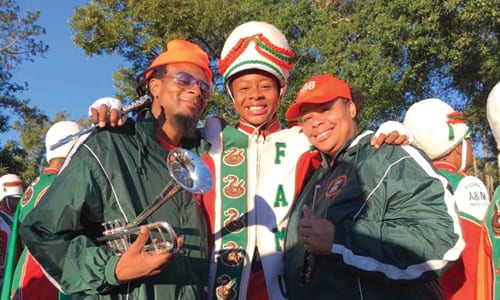 Cori Renee Bostic, center, poses with her parents at FAMU Homecoming game. Photo via Facebook