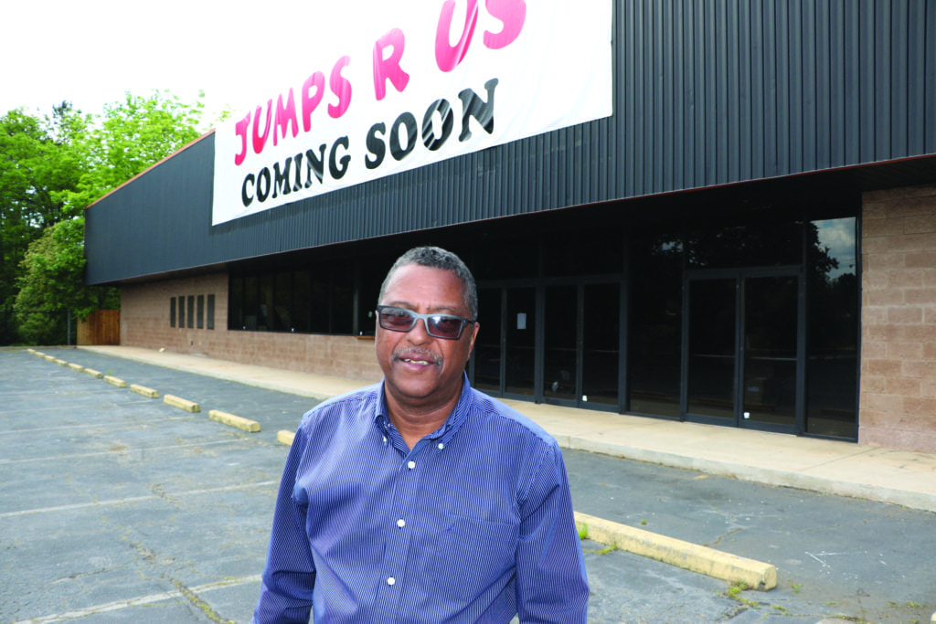 James Burnett stands in the parking lot of the former arts center, 5616 Memorial Drive in Stone Mountain, where he is opening the Elite Executive Center and Jumps R Us. Photo by Glenn L. Morgan/OCG News 