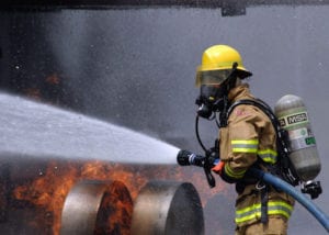 080730-N-5277R-003  ATSUGI, Japan (July 30, 2008) A Commander, Naval Forces Japan firefighter douses a fire on a dummy aircraft during the annual off-station mishap drill at Naval Support Facility Kamiseya. Emergency response and rescue teams were tasked with putting out a simulated fire, and rescuing two personnel from a plane crash scene. U.S. Navy photo by Mass Communication Seaman Barry Riley (Released)