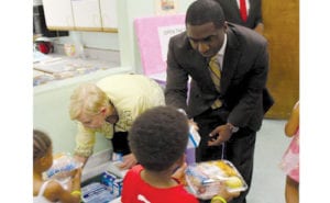 Interim CEO May and First Lady Deal served meals to youth during the kickoff summer meals program