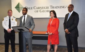 DeKalb Interim CEO Lee May discusses recent training received by the Police Department’s command staff, as DeKalb County Police Chief James Conroy, Dale Carnegie Training of Georgia CEO Wendy Johnson and Deputy COO for Public Safety Cedric Alexander look on.