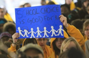 110125 Atlanta: Signs were everywhere Tuesday during the rally. Hundreds of parents and students attended the School Choice Celebration and Rally at the Georgia State Capitol Tuesday, Jan. 25, 2011. The gathering rallied to push state lawmakers to expand educational options for Georgia families. The event joined together unlikely allies, public and private school leaders in a display of unity where they urged lawmakers to expand scholarship opportunities so parents can better afford to pick their children's schools. Private schools want the state to raise the $50 million cap on the tax-credit scholarship that has helped hundreds of public school students transfer to private schools. Charter school officials want the state to support the continued funding of their campuses, which faces a state Supreme Court challenge from a handful of Georgia public school systems. The rally comes as the country celebrates National School Choice Week. David Pusey, director of a Center for an Educated Georgia, said more metro Atlanta parents appear to be concerned about choice than ever before, especially with accreditation problems at Atlanta Public Schools. John Spink jspink@ajc.com