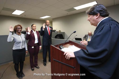 L-R: Stonecrest City Councilmembers Diane Adoma (District 5), Jazzmin Cobble (District 3), and Jimmy Clanton (District 1) were sworn in by Municipal Judge Jonathan Weintraub for their first full term on Jan. 3 during a special called City Council meeting. Photo by Travis Hudgons / OCGNews