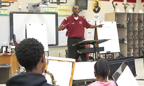 Salem Middle School’s Band Director H. T. Monte conducts members of the band during a rehearsal . Photo by Travis Hudgons/OGC News