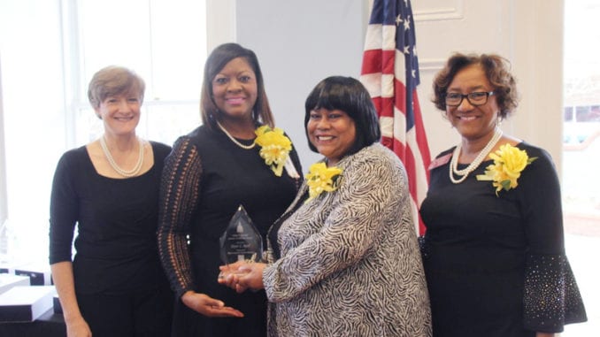 L-R: Wearing smiles, pearls and yellow corsages in honor of the Servant Leader Award are State Rep. Sherri Gilligan, co-chair of the Georgia Legislative Women’s Caucus, former Rep. Nikki T. Randall, Joyce Reid and State Rep. Karen Bennett. 