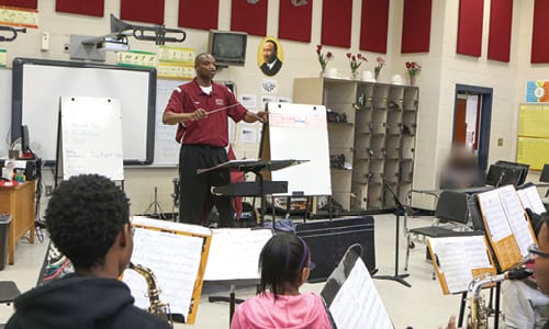 Salem Middle School’s Band Director H. T. Monte conducts members of the band during a rehearsal . Photo by Travis Hudgons/OGC News