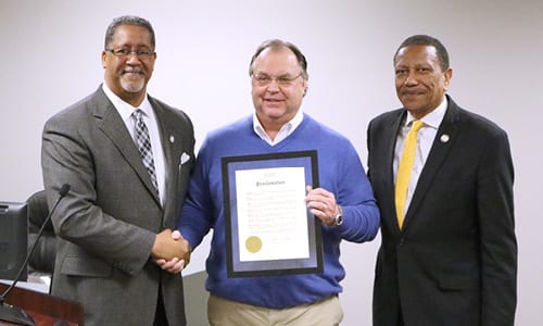 Mayor Jason Lary and District 1 Councilmember Jimmy Clanton pose with Joe Coleman, owner of CS Truck and Trailer.