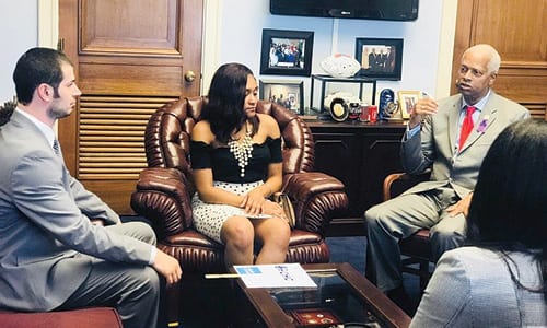 L-R: Redan High School Coach William Roth joins Alexis Goings, Congressman Hank Johnson and Shania Hinds in a discussion about their winning portfolio. Photo provided