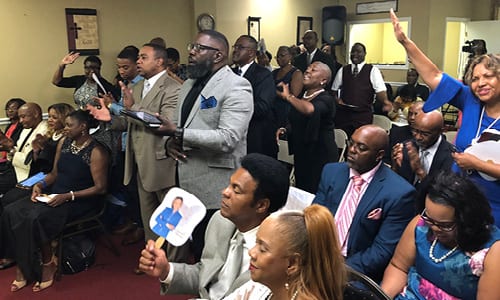 The congregation and visitors rejoicing during Bishop Hawkins’ message.