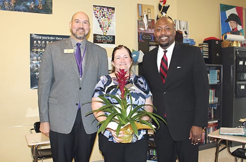 Liz McGowan (center) with RCA CEO Ben McCumber (left) and Superintendent Dr. Terry Oatts. 