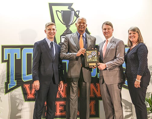 GDEcD Deputy Commissioner of Tourism Kevin Langston joins GDEcD Commissioner Pat Wilson and GACVB President Rashelle Beasley to present The Bill Hardman Sr. Tourism Government Champion Award to Congressman Hank Johnson.