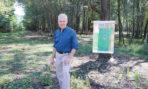 Founder Joe Eifred stands at the site of the Rockdale Art Farm, which will offer woodworking, metal-working, jewelry making, painting, sculpting, pottery and other pursuits. Photo by Glenn L. Morgan     